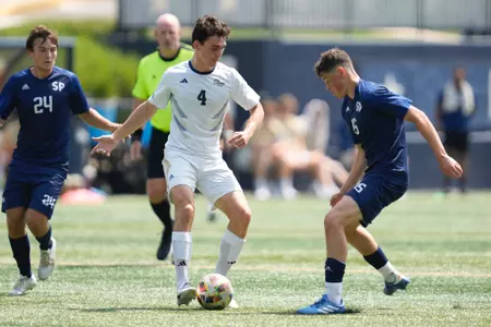 Will Turner looking to get past a Saint Peter's defender at the GW Soccer Field