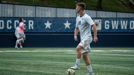 Joe Liebe standing over the ball at the GW Soccer Field