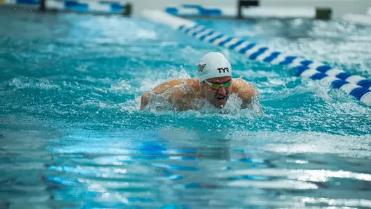 Philip Moldovanu swimming at the 2024 A-10 Championships