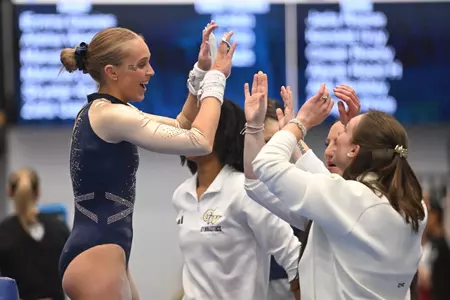 Lola Montevago Celebrates the end of her bar routine