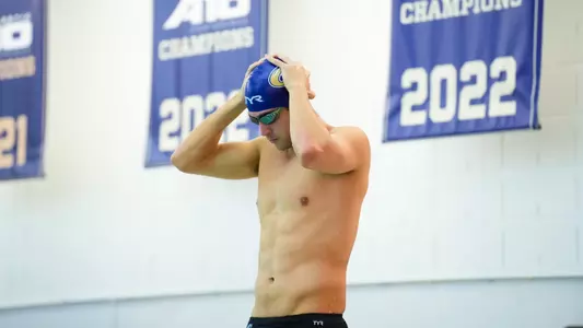 Philip Moldovanu prepares to swim at a swimming practice