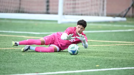 Diego Pena sliding towards the ball