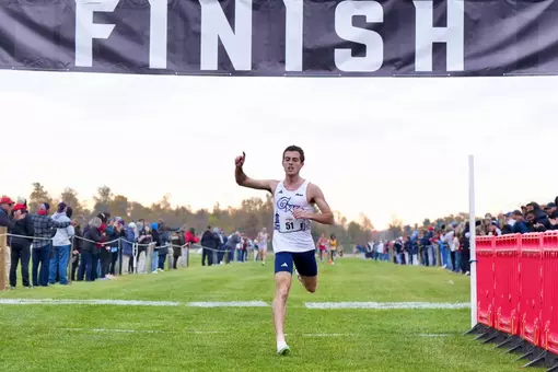 Michael Bohlke crosses the finish line to win the A-10 Championship