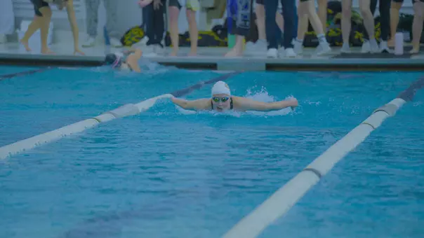 Ava Topolewski swimming butterfly at the Smith Center