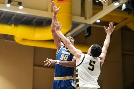 Rafael Castro hooks a shot over an Army defender