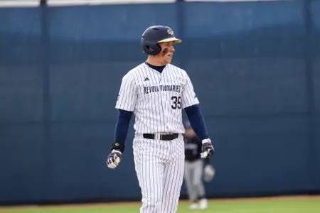 Conlon Walker Watches the Play from Second Base vs. Holy Cross