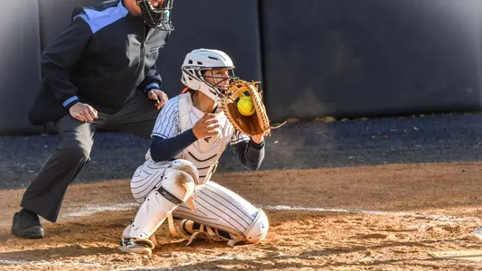 Allison Heffley catching at the GW Softball Field
