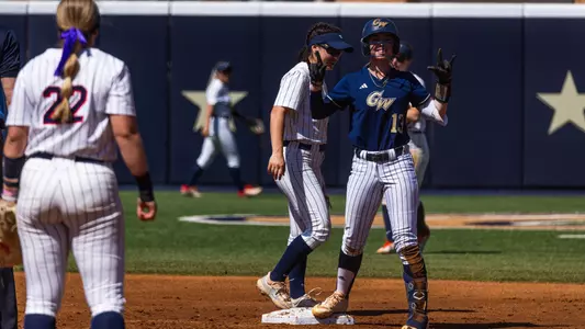 Kaylee Layfield celebrating reaching second base against Dayton