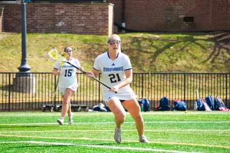 Everly Kessler and Sophia Levine look to set up the offense at the GW Lacrosse Field