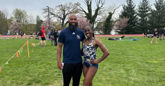 Dami Oyatayo poses after posting a program record at the Hopkins Invitational