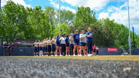 Softball lines up for the national anthem ahead of the A-10 Championship