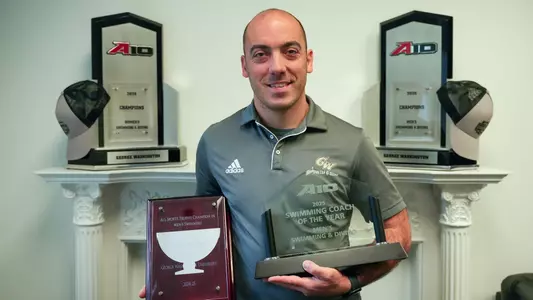 Chico Rego Stands with NACDA ADA D I-AAA All Sports Trophy