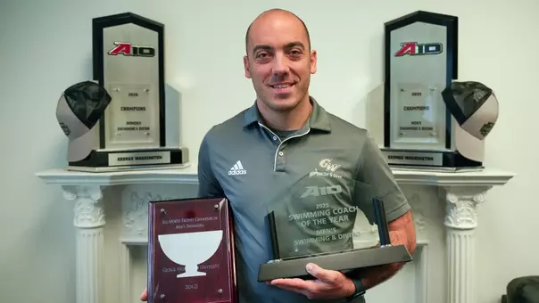 Chico Rego Stands with NACDA ADA D I-AAA All Sports Trophy