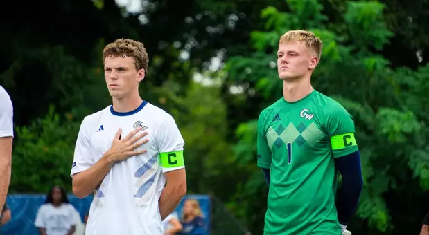 Tom Macauley and Colin Prendergast standing for the National Anthem