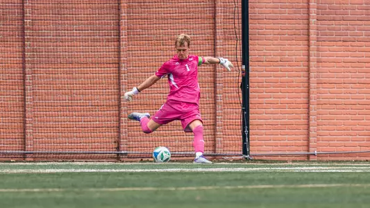 Tom Macauley kicking the ball on a goal kick