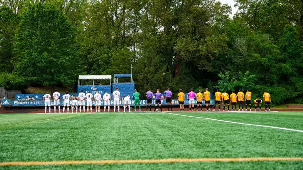 GW men's soccer and VMI lining up for the national anthem