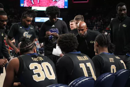Assistant Coach Dwayne Lee talks during a timeout