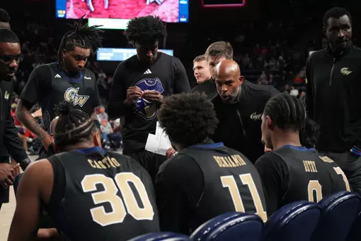 Assistant Coach Dwayne Lee talks during a timeout