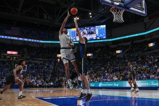 Rafael Castro attempts a jump shot at Saint Louis