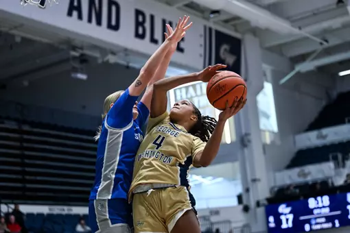Sara Lewis Extends of a Saint Louis Defender for the Layup