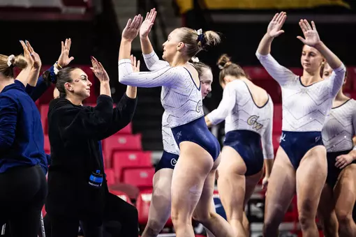 Lola Montevago finishes her beam routine at Maryland on opening night