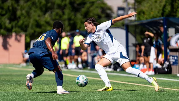 Tommaso Lami dribbling at a defender