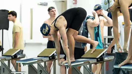 Women's swimming & diving on the blocks at Smith