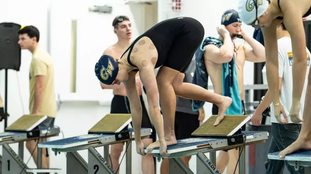 Women's swimming & diving on the blocks at Smith