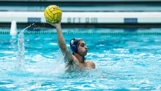 Konstantinos Kapragkos holding the ball above his head
