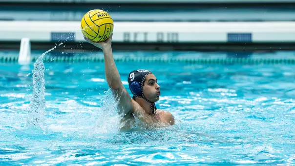 Konstantinos Kapragkos holding the ball above his head