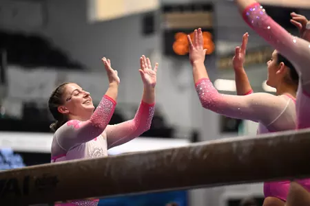 Kylie Kazmierski and Brooke Izzo celebrate in the Smith Center