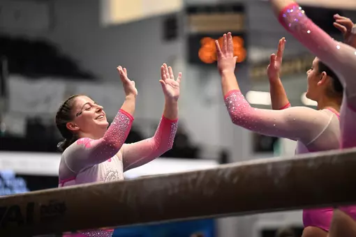 Kylie Kazmierski and Brooke Izzo celebrate in the Smith Center