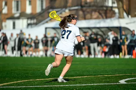 Grace Curry moves the ball into GW's attacking zone at the Vern