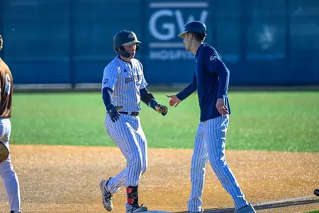 Robbie Lavey and Tanner Sinicki High-Five After a Hit vs. Lehigh