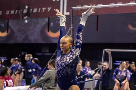 Lola Montevago finishes bar routine at Temple