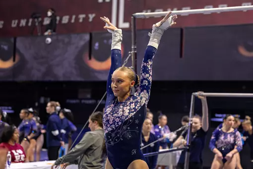 Lola Montevago finishes bar routine at Temple