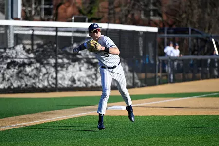 Travis Peitz Makes a Running Throw from Third Base