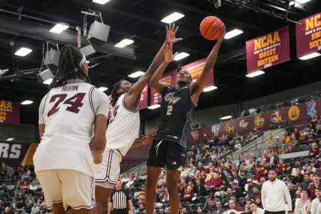 Christian Jones shoots a layup at Loyola Chicago