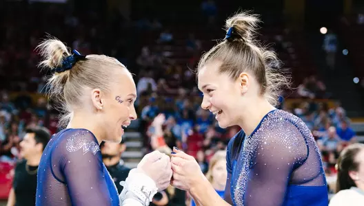 Lola Montevago and Deana Sheremeta fist bump at NCAA Regionals