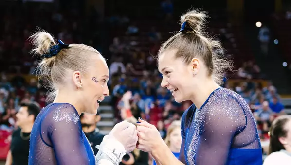 Lola Montevago and Deana Sheremeta fist bump at NCAA Regionals