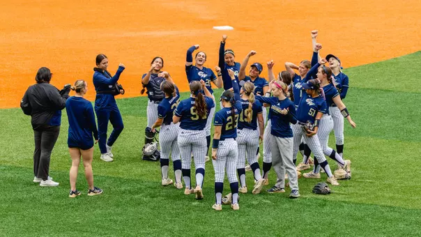Softball team celebrating a victory