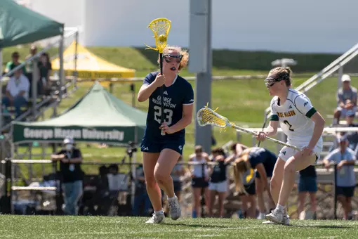 Maggie Pond moves the ball against George Mason