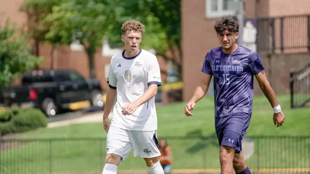 Colin Prendergast standing next to an ODU player