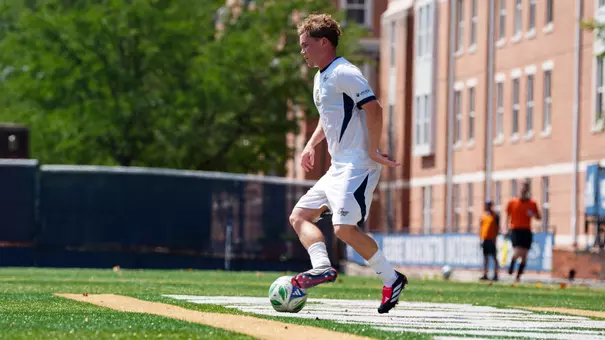 Joe Brayson dribbling at the GW Soccer Field