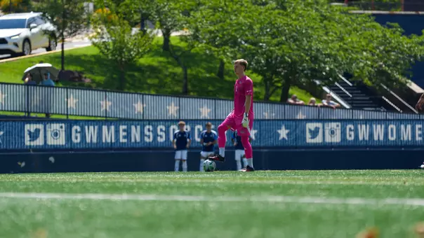 Tom Macauley standing over the ball at the GW Soccer Field