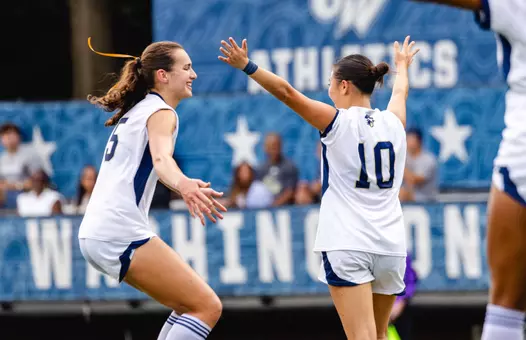 Julia Bilal and Kalia Kau Celebrate a Goal vs. American