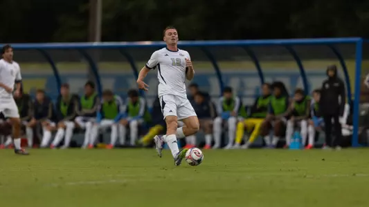 Jake Poole dribbling at Delaware