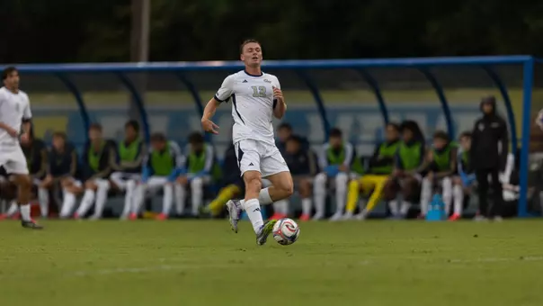 Jake Poole dribbling at Delaware