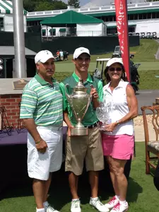 Anania with his trophy alongside parents Geno and Dorie.