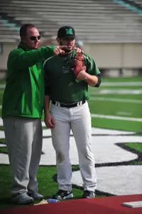 Herd pitching coach Josh Newman with senior hurler Clint Wilson during individuals